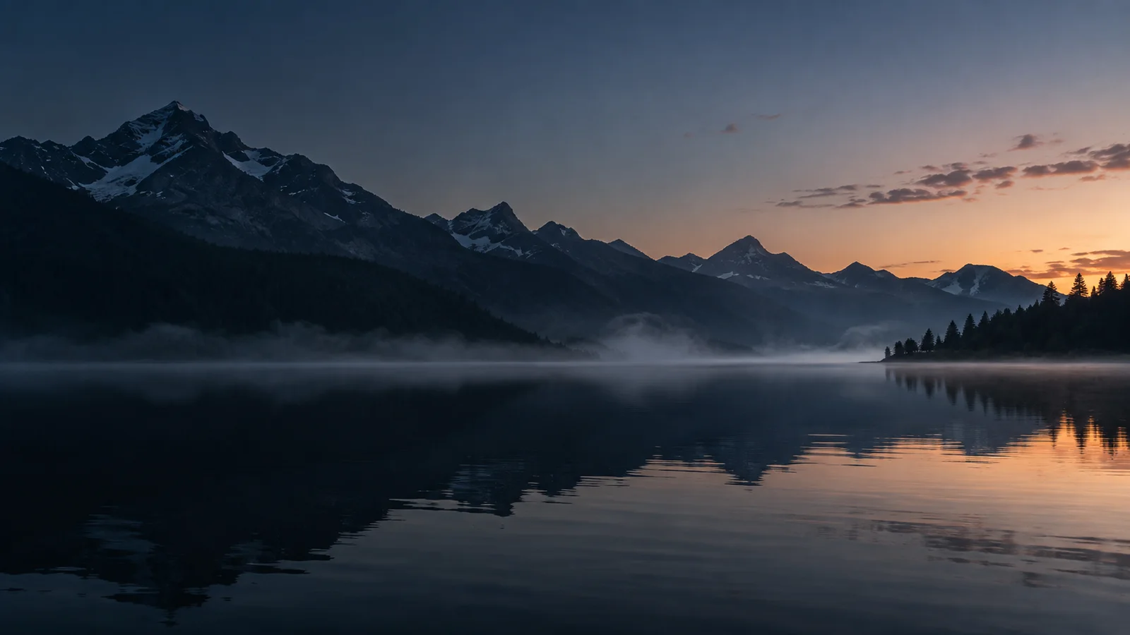 The first morning light over a still lake.